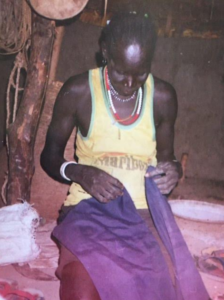Alepho and Benson's Mother in her hut in Juol, South Sudan