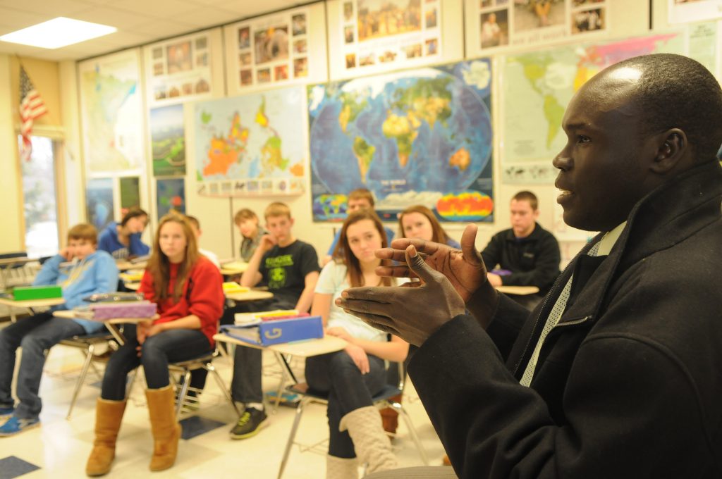 Alepho speaking at a middle school